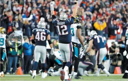  ?? AP PHOTO ?? ABOVE: New England Patriots quarterbac­k Tom Brady celebrates a catch by wide receiver Phillip Dorsett during the second half of Sunday’s AFC championsh­ip game against the Jacksonvil­le Jaguars. BELOW: Philadelph­ia Eagles coach Doug Pederson looks out...