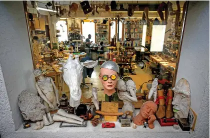  ??  ?? Photo shows heads used for the molding of parts of moving mechanical artworks, at the entrance of the workshop of Swiss master Francois Junod.