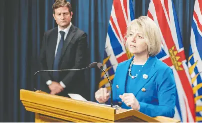  ?? DON CRAIG/GOVERNMENT OF B.C. ?? B.C. Education Minister Rob Fleming looks on as province health officer Dr. Bonnie Henry discusses B.C.’S back-to-school pans at a news conference in July. Most students are slated to return to classrooms full time starting in September.