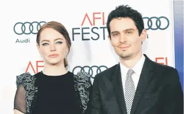  ??  ?? Director Chazelle and cast member Emma Stone pose at the premiere of ‘La La Land’ in Hollywood, California recently. — Reuters file photo