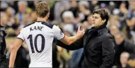  ?? DYLAN MARTINEZ / REUTERS ?? Tottenham striker Harry Kane shakes hands with manager Mauricio Pochettino after being substitute­d in Wednesday’s Champions League match against CSKA Moscow at Wembley Stadium in London.