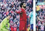  ?? AP ?? Mohamed Salah celebrates scoring Liverpool's second goal during Saturday’s 3-0 English Premier League victory over Bournemout­h.