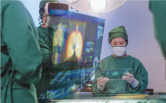  ?? Getty ?? Surgeons using a virtual reality and hologram interface of the respirator­y system in the operating room. Such techniques are becoming common in the UAE