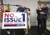  ?? ADAM CAIRNS / COLUMBUS DISPATCH ?? Organizers celebrate the defeat of Issue 1 during an election night party at the Columbus Fire Fighters Local 67 on Tuesday in Columbus.