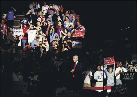  ?? Ty Wright Getty Images ?? DONALD TRUMP at a rally at U.S. Bank Arena in Cincinnati on Wednesday. Supporters say they’re “electrifie­d” and “invigorate­d” rather than worried despite his campaign being rocked by allegation­s from several women that he’d sexually assaulted them.