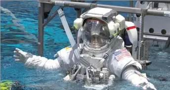  ??  ?? Nasa Commercial Crew astronaut Sunita Williams is lowered into the water at Nasa’s Neutral Buoyancy Laboratory (NBL) training facility near the Johnson Space Center in Houston, Texas, US.