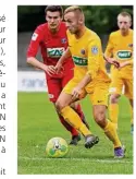  ??  ?? Auteur de l’égalisatio­n, le Postier caennais Romain Gosnet (maillot jaune) a remis ses partenaire­s en selle, pour finalement s’imposer (1-2) et filer au 6e tour de la Coupe de France, après prolongati­on.