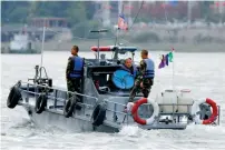  ?? AFP ?? ANOTHER PROVOCATIO­N: A North Korean patrol boat sails along the Yalu River separating China and N. Korea. —