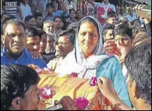  ?? HT PHOTO ?? Krishna Poonia coming out of a counting station at Sadulpur in Churu district of Rajasthan after her victory.