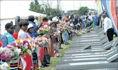  ?? PHOTO: VELI NHLAPO ?? Families lay wreaths during the 25th anniversar­y of the Sebokeng massacre where 39 people were killed while attending an all-night vigil.