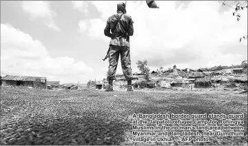  ??  ?? A Bangladesh border guard stands guard at the Jalpatoli refugee camp for Rohingya Muslims in the no-man’s land area between Myanmar and Bangladesh, near Gumdhum village in Ukhia. — AFP photo