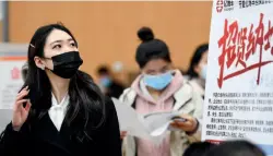  ??  ?? A job seeker at a women’s job fair for the services industry in Yinchuan, Ningxia Hui Autonomous Region, March 6, 2021