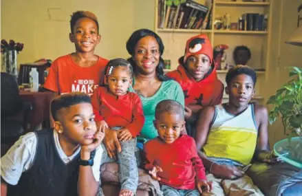  ??  ?? Tyshika Britten poses with her children, from left: Nazhia Bolden, 11; Donnell Booker Jr., 8; Morgan Booker, 1; Chase Booker, 3; Nevaeh Bolden, 13; and Vashon Bolden, 15. Jonathan Newton, The Washington Post