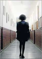  ?? Picture: FREDLIN ADRIAAN ?? LONG WALK: Unathi Gongxeka walks down a corridor at Lawson Brown High School