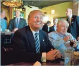  ?? MATT ROURKE, AP ?? Donald Trump, accompanie­d by North Charleston, S.C., Mayor Keith Summey, stops for lunch Thursday.