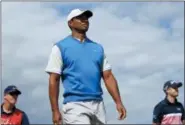  ?? JON SUPER — THE ASSOCIATED PRESS ?? Tiger Woods walks from the fourth tee during the first round of the British Open on July 19 in Carnoustie, Scotland.