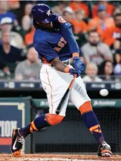  ?? Associated Press ?? n Houston Astros' Cameron Maybin hits a three-run home run off New York Mets starting pitcher Chris Flexen during the third inning of a baseball game Sunday in Houston.