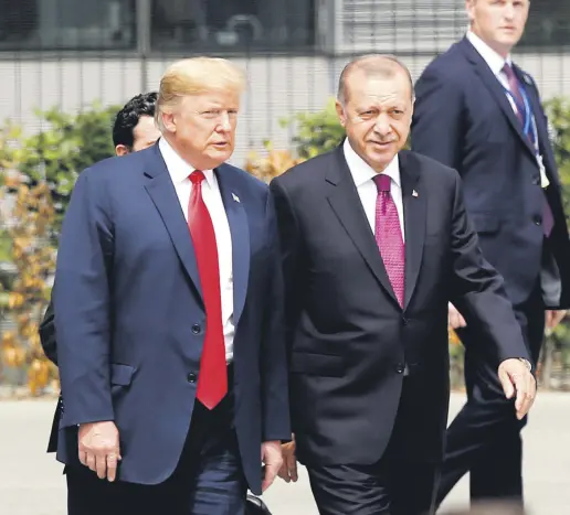  ??  ?? President Recep Tayyip Erdoğan and U.S. President Donald Trump talk at the start of the NATO summit in Brussels, July, 11.