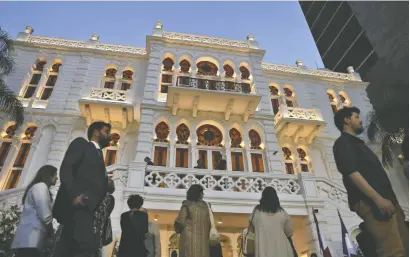  ?? JOSEPH EID/AFP VIA GETTY IMAGES ?? People attend the reopening of the Sursock Museum in the Lebanese capital Beirut last month, more than two years after a catastroph­ic port explosion devastated the architectu­ral gem. The blast was the culminatio­n of a failed state.