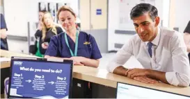  ?? (AFP) ?? Rishi Sunak speaks to staff during a visit to University Hospital of North Tees in Stockton-on-tees on Monday