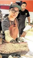  ?? J.R. Cohen / Contributo­r ?? Pitmaster Quy Hoang at Blood Bros. BBQ in Bellaire