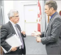  ?? MITCH MACDONALD/THE GUARDIAN ?? Opposition MLA Jamie Fox, right, chats with Communitie­s, Land and Environmen­t Minister Richard Brown prior to Tuesday’s question period. Fox says a number of Islanders are having difficulti­es accessing legal aid due to the financial threshold.