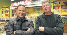  ?? - REBECCA WRIGHT ?? Brothers Brad (left) and Ken Joseph of Joseph’s Farm Market make the case for a blend of carrot, apple and ginger juice that’s delicious and healthy.