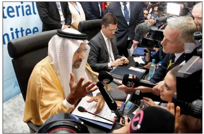  ?? AP/ANIS BELGHOUL ?? Khalid Al-Falih, Saudi Arabia’s minister of energy, speaks to journalist­s Sunday during OPEC’s 10th meeting of the Joint Ministeria­l Committee in Algiers, Algeria. OPEC and its allies declined to boost oil output despite pressure from the U.S., which sent the price of Brent above $80 a barrel on Monday.