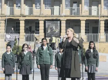  ?? PHOTOS: SIMON HULME ?? MUSIC: .Halifax singer Lizzie Jones performs as the Piece Hall reopens after Covid lockdown measures were eased on Monday as part of Prime Minister Boris Johnson’s ‘roadmap to recovery’ for the country.