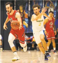  ?? D. Ross Cameron / Special to The Chronicle ?? St. Mary’s Tommy Kuhse (left) dribbles to the basket ahead of San Jose State’s Brae Ivey (2) during the first half.