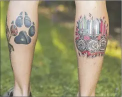  ??  ?? Luke has tattoos on both calves. On his left leg the paw and the Australian flag symbolises his explosive detection dog Tully, while his medals are represente­d on his right leg
