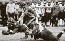  ?? Brett Coomer / Staff photograph­er ?? Ravens QB Lamar Jackson was 17-of-24 for 222 yards with four TDs and rushed for 79 yards against the Texans last season.