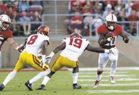  ?? Marcio Jose Sanchez / Associated Press ?? Bryce Love (No. 20) averaged 4.6 yards per carry in his season debut against USC.