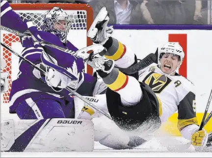  ?? Frank Gunn ?? The Associated Press Golden Knights left wing David Perron, right, tumbles over Maple Leafs goalie Frederik Andersen during Vegas’ 4-3 shootout loss Monday night in Toronto. The Knights fell to 1-3-1 on their six-game eastern road trip, with the final...