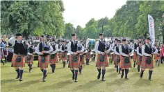  ??  ?? The band put their new pipe bags and chanters to good use at the recent European Championsh­ips at Forres.