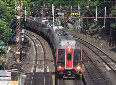  ?? Tyler Sizemore / Hearst Connecticu­t Media ?? A train speeds through the Greenwich Metro-North Railroad station on June 10.