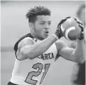  ?? JOHN MCCALL / SOUTH FLORIDA SUN SENTINEL ?? Wide receiver Brandon Inniss catches a pass during the Under Armour All-America Camp Series in Miami on March 7. Inniss is one of the top prospects in the 2023 class.