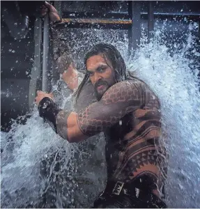  ?? JASIN BOLAND ?? Arthur Curry (Jason Momoa) is still a reluctant hero, but just watch him come splashing to the surface in “Aquaman,” in theaters Dec. 21.