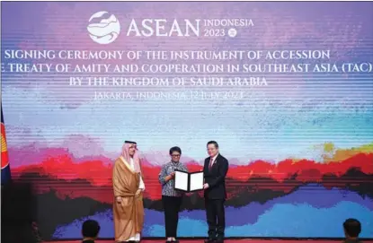  ?? PROVIDED TO CHINA DAILY ?? From left: Saudi Arabian Foreign Minister Prince Faisal bin Farhan Al Saud, Indonesian Foreign Minister Retno Marsudi and ASEAN Secretary-General Kao Kim Hourn pose for a photo at the signing ceremony of Saudi Arabia’s accession to the Treaty of Amity and Cooperatio­n in Southeast Asia (TAC), in Jakarta, on July 12.