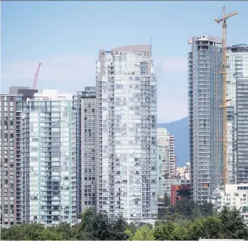  ?? DARRYL DYCK/THE CANADIAN PRESS ?? The B.C. Ministry of Finance says it will require the reporting of all presale condo transactio­ns, including assignment­s, which would improve clarity in the market.