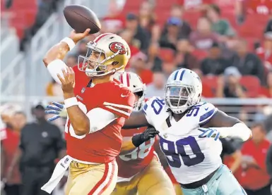  ?? Tony Avelar / Associated Press ?? Jimmy Garoppolo threw six passes Thursday, including this one in front of Dallas’ Demarcus Lawrence.