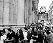  ?? REUTERS ?? Customers wait in queue at the entrance of Starbucks Reserve Roastery during the opening day in downtown Milan