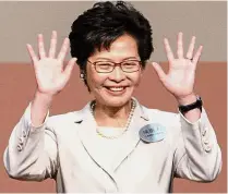  ?? — AFP ?? New era: Lam has pledged to mend political rifts after winning the Hong Kong chief executive election.