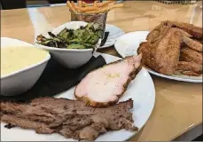  ??  ?? Rivertown Brewery and Barrel House in Monroe features a pick-yourown-meat plate (two meats for $17 or three for $20). The brisket and the turkey breast were savory, succulent and fork tender.