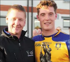  ??  ?? Declan Byrne receives the man-of-the-match award from Billy Lawlor of CTI Business Solutions.