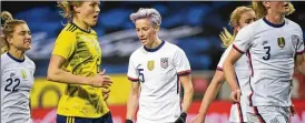  ?? JANERIK HENRIKSSON / TT VIA AP ?? United States’ Megan Rapinoe (center) celebrates after scoring on a penalty kick against Sweden during a women’s internatio­nal friendly in Stockholm, Sweden, on Saturday.