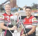  ??  ?? Kirwan's Bradley Schneider and Tareq Parter celebrate with the state championsh­ip trophy.