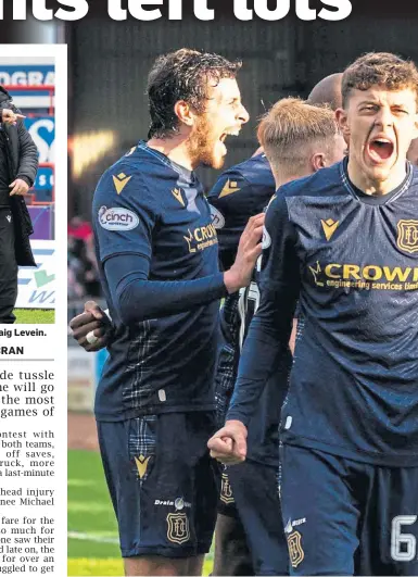  ?? ?? PARTY TIME: Dundee players celebrate Jordan McGhee’s late winner