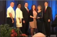  ?? GINGER RAE DUNBAR — DIGITAL FIRST MEDIA ?? John Moss presented the Wong Moss Outstandin­g Alumni Award on Tuesday, which was bestowed on the LeToureau family in honor of the late Philadelph­ia Fire Capt. Matthew LeTourneau, a 1995 graduate of Delaware County Community College. Pictured from left to right are: Philadelph­ia Fire Commission­er Adam K. Thiel, President Dr. L. Joy Gates Black, brother Luke LeTourneau, sister Michelle LeTourneau, mother Janice LeTourneau and John Moss.