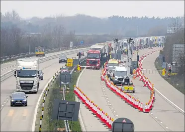  ??  ?? Operation Brock is still in place on the M20; bosses say the barrier on the London-bound side is 12.3 miles long and consists of 19,563 individual blocks